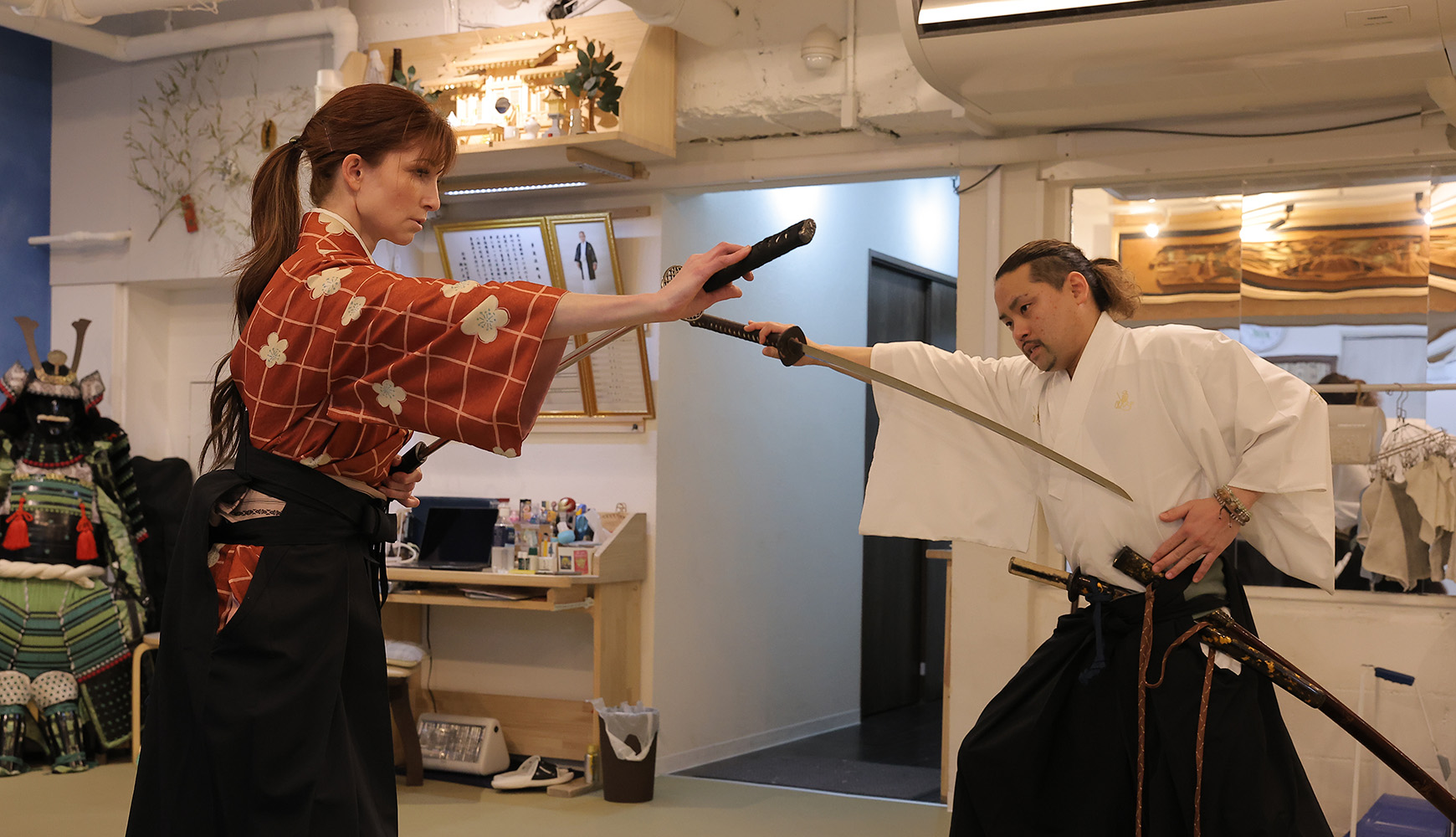 A guest performing kata while Yushin-sensei watches and personally evaluates