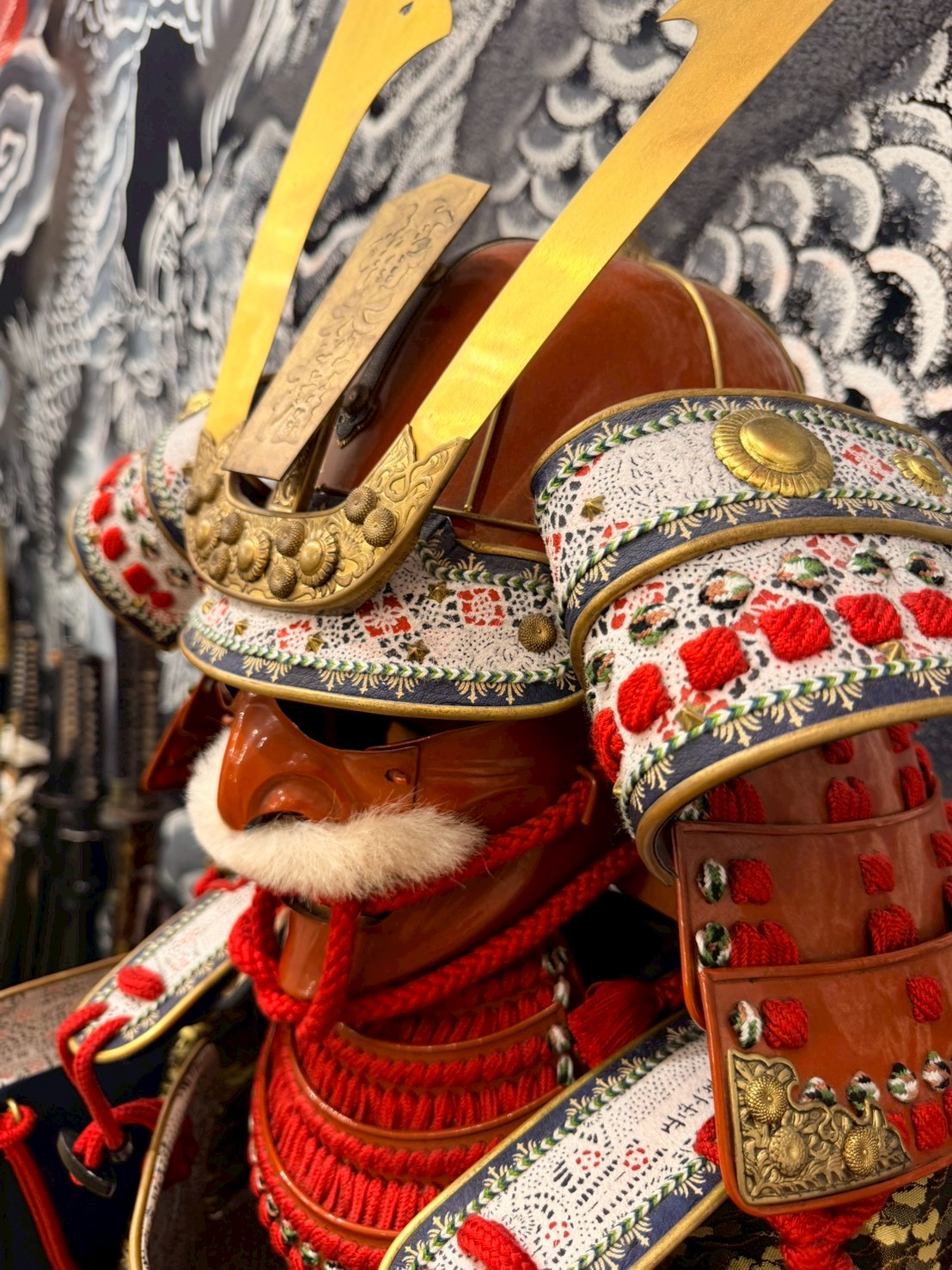 Samurai helmet (kabuto) with gold crest, side view