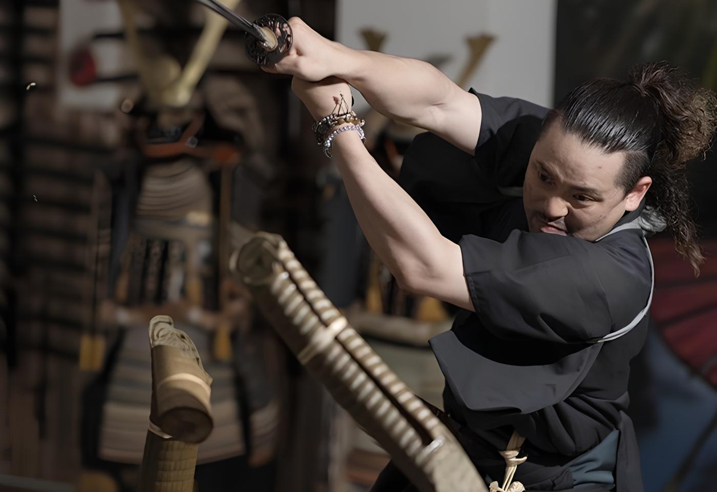 The Yushinkan master mid-cut during a sword demonstration in the Kyoto dojo